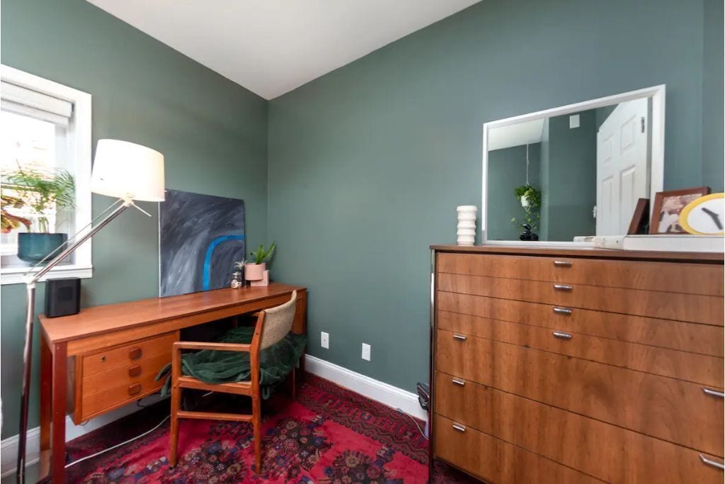 There is a workspace in the guest bedroom.