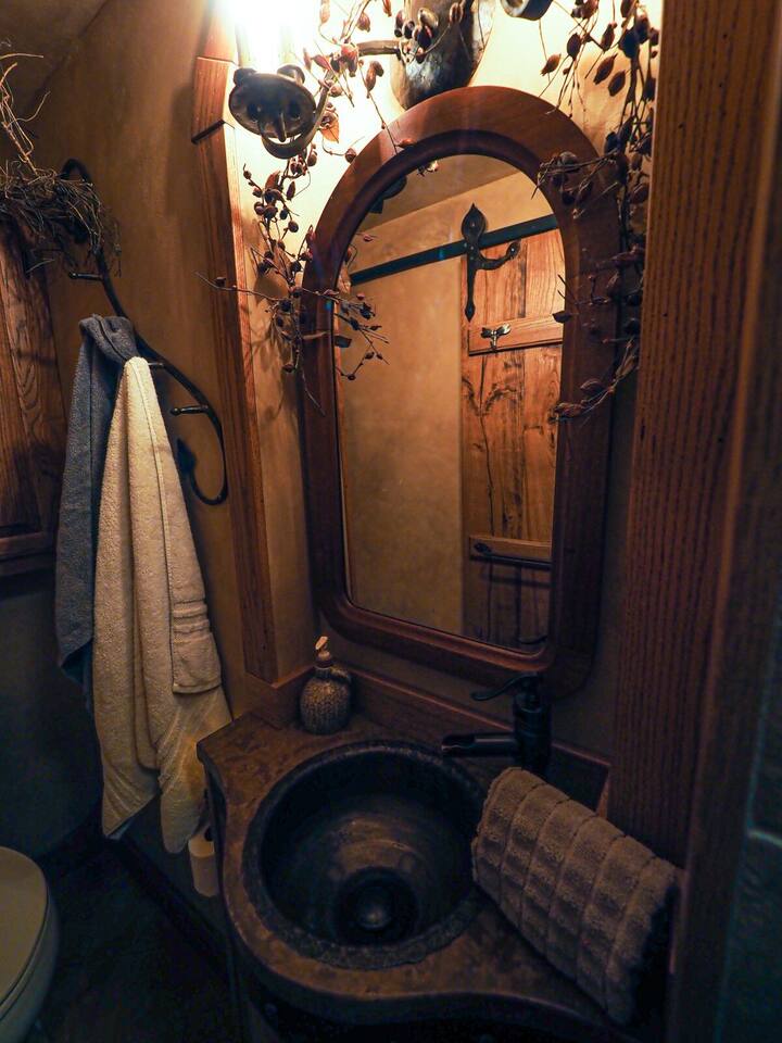 All the Comforts of Home! The sink was created from an expired propane tank! Notice the slider door for your privacy in the reflection of the mirror. We provide towels, wash clothes, liquid soap, shampoo, conditioner, hair dryer and a First Aid Kit! 