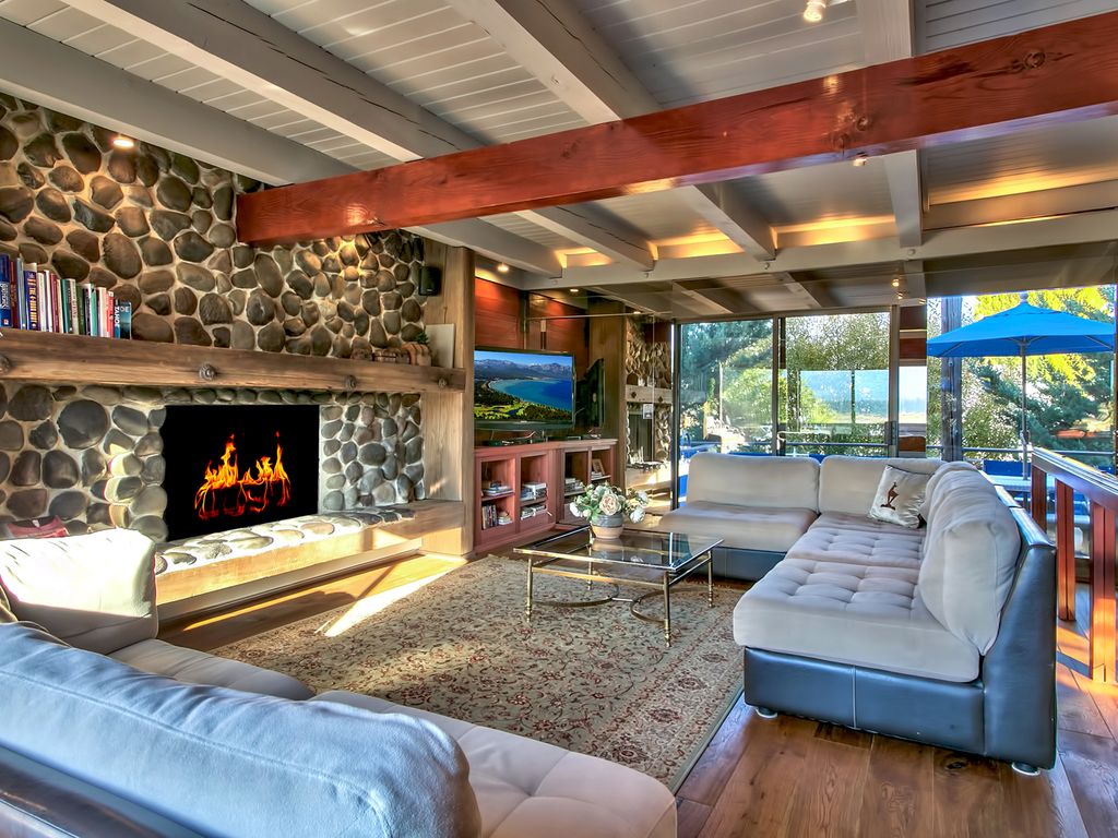 2nd level living room with fireplace and entertainment