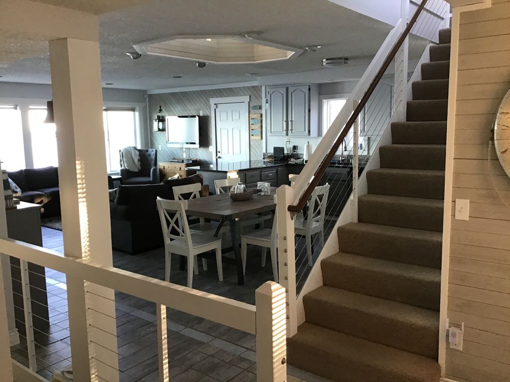 View from the main entry to the Kitchen/Dining area and Family Room.
