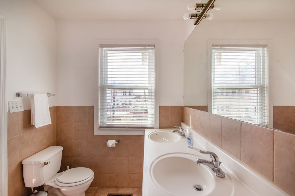 Primary Bathroom With Double Sink and Jacuzzi Tub