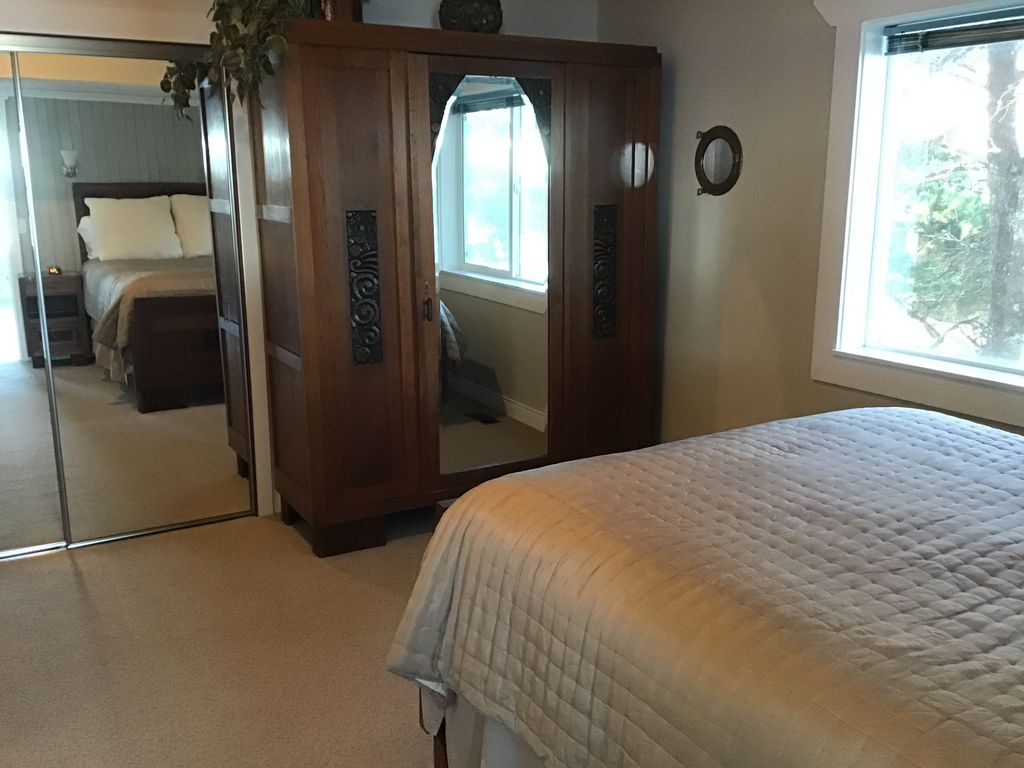 Third floor bedroom with antique furnishings.