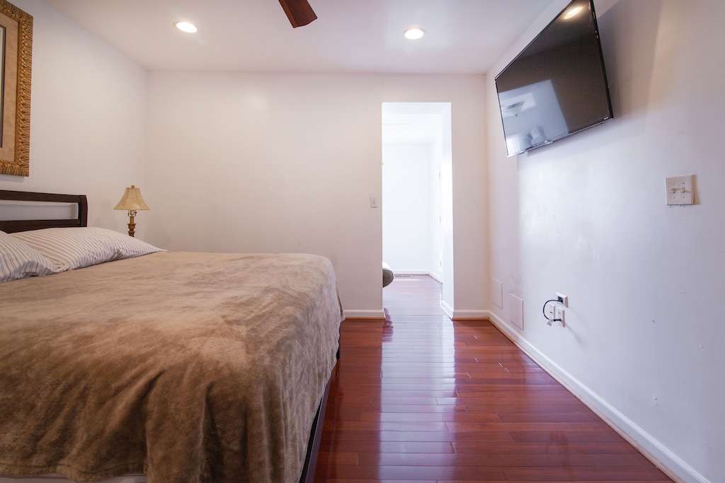 Primary Bedroom with Private Bathroom, Den and King Bed With Large Smart TV