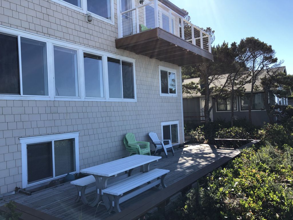 Main Deck; Picnic Table with third floor deck in view.