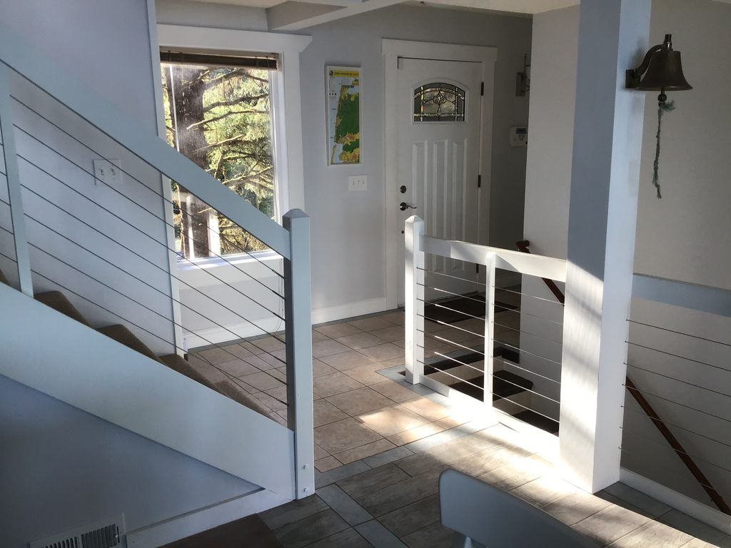 View from the dining area to the main entry, stairways to the 1st and 3rd floor.