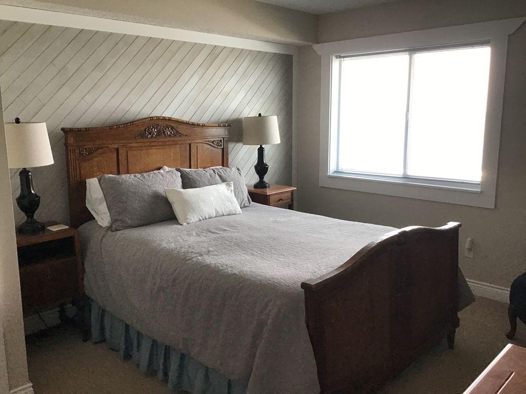 Main level bedroom with ocean view. Private bathroom adjoins the bedroom.