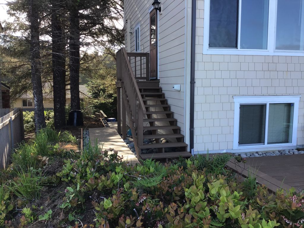 Stairs leading from the second level to the beach-side main deck. 