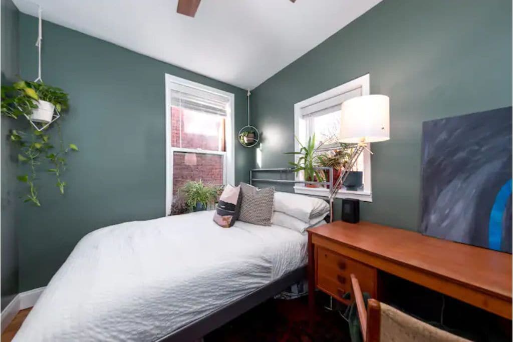 The guest bedroom has a comfy, med-firm, full-size bed in a cozy plant nook.