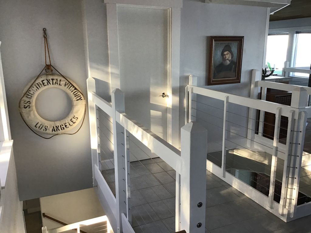 Third floor. Door to the Bthrm. Note, World War II Victory Ship Life Preserver.